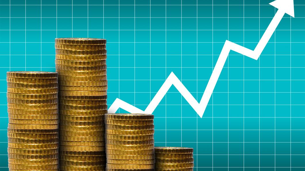stockvault--money-in-a-pile-of-coins-with-financial-graph181077.jpg